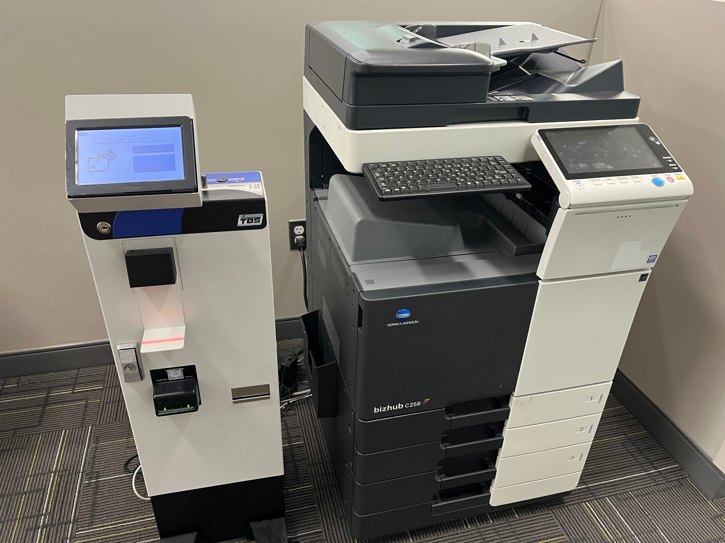 Copy machine and coin tower.