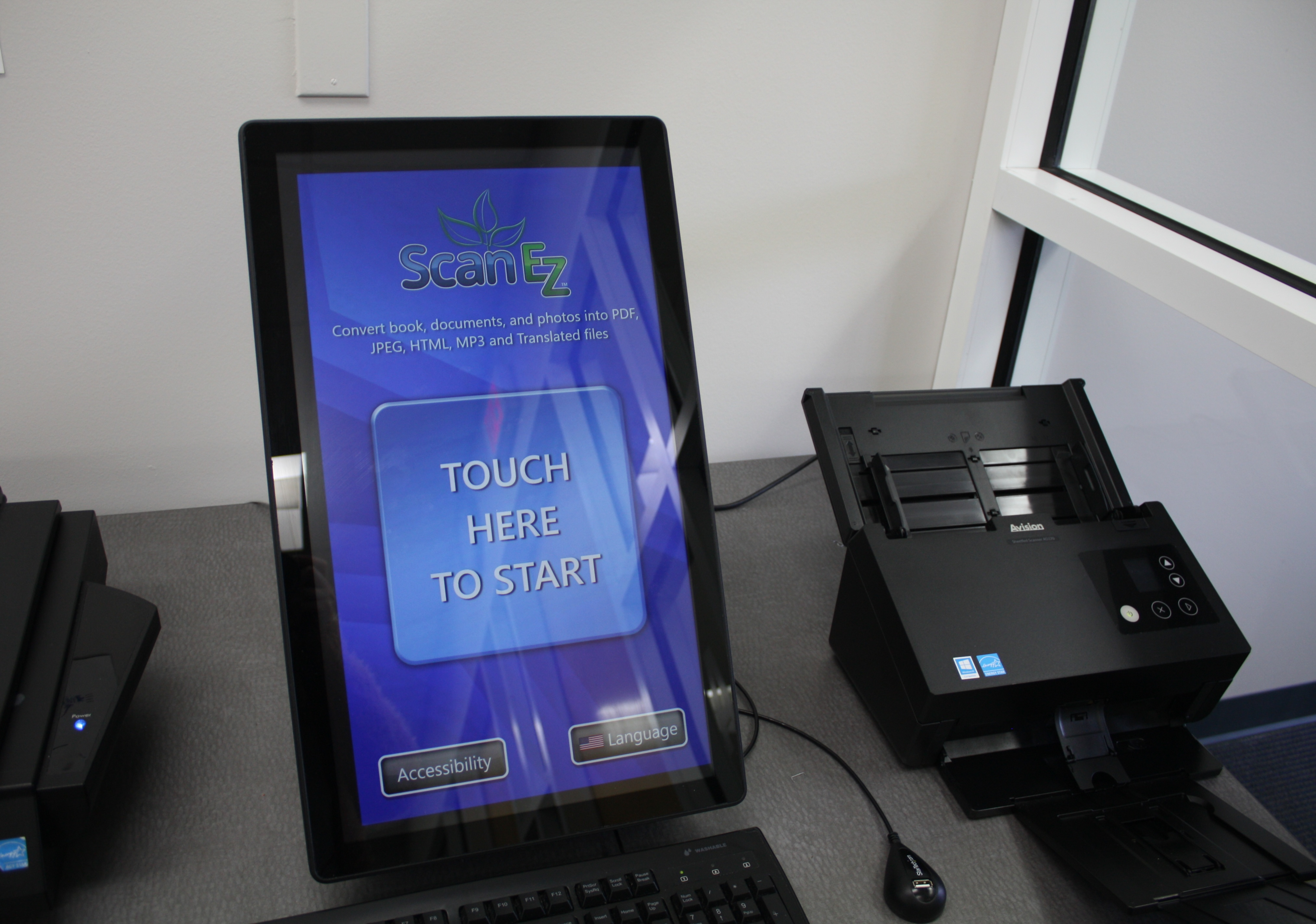 Large tablet displaying Touch to Scan.